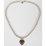 TIFFANY & CO. BEADED, STERLING SILVER NECKLACE AND HEART PENDANT, LATE 20TH C, L 18"Tiffany & Co.