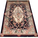 CHINESE, HAND WOVEN WOOL RUG, H 6' 1'', W 4'Having a navy ground with floral bouquets and acanthus