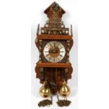 DUTCH ZAANS OAK WALL CLOCK H 22"Having brass accents, Roman numerals and a finial figure of a man