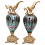 ART GLASS AND METAL EWERS, C.1880, PAIR, H 14''.Circa 1880. Iridescent bulbous glass on footed metal