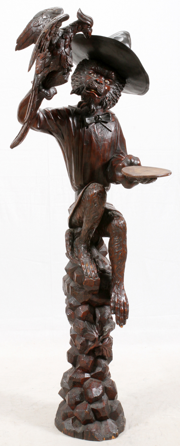 BLACK FOREST CARVED WALNUT SCULPTURE, H 72", W 27"In the form of a chimpanzee resting atop a