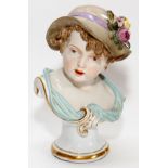 MEISSEN PORCELAIN BUST OF A CHILD, 19TH C., H 7"Molded as a bust of a girl wearing a hat with flower