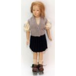 DEWEES COCHRAN DOLL, C.1935, H 15"A composition girl doll, with handpainted features dressed in wool