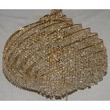 TEN-LIGHT BRASS AND CRYSTAL "ORB" CHANDELIER, H 24", DIA 28"Having a brass sphere or swirl design.