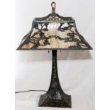 SLAG GLASS AND SPELTER TABLE LAMP, H 24''An all-over motif of bridges, boats, and branches.- For