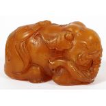 CHINESE CARVED HARD STONE RECUMBENT ELEPHANT, H 1.75", L 2.75"Depicting a recumbent male elephant.