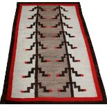 NAVAJO WOOL RUG, C..1900 - EARLY 20TH C., W 3' 11", L 6' 2"Grey, brown, red and white.Outer edging