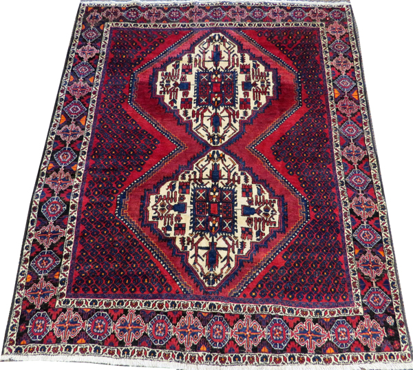 PERSIAN SIRJAN WOOL CARPET, C.1980-90, 6' 5" X 5' 3"having a red ground with three borders with