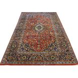 PERSIAN KASHAN WOOL CARPET, 11' 4" X 8'An all over foliate design over a red ground with accenting