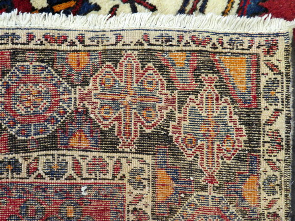 PERSIAN SIRJAN WOOL CARPET, C.1980-90, 6' 5" X 5' 3"having a red ground with three borders with - Image 4 of 4