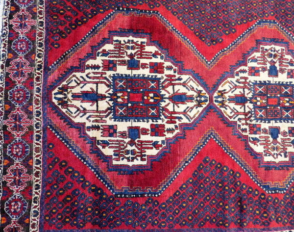 PERSIAN SIRJAN WOOL CARPET, C.1980-90, 6' 5" X 5' 3"having a red ground with three borders with - Image 3 of 4