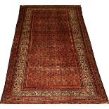 PERSIAN SARABEND WOOL RUG, C. 1920 - 1950, W 4', L 6' 6"Red ground with rows of small pears with the