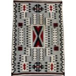 NAVAJO KLAGETOH STYLE HAND WOVEN WOOL MAT, W 24", L 36"Having a gray field with geometric feather