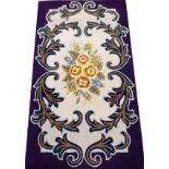 AMERICAN HANDMADE WOOL CARPET, C.1960, 5' 2" X 3'having a beige ground, irregular dark purple