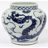 CHINESE BLUE WHITE PORCELAIN VASE, H 8.25", DIA 9.25"Featuring designs of dragons and clouds.