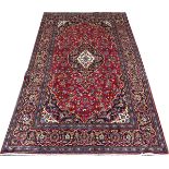 PERSIAN KASHAN WOOL CARPET, 1990-00, 10' 5" X 6' 8"A flowering design overall; in shades of