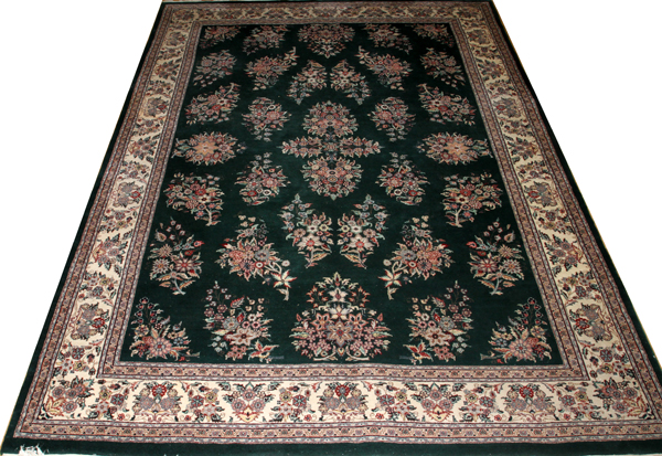 KARABAUGH, PERSIAN, HAND WOVEN WOOL CARPET, W 8' 10", L 12' 3"having seven borders, forest green