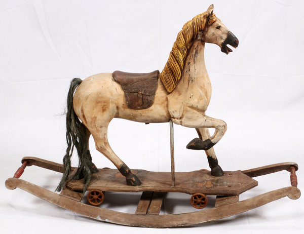 ANTIQUE CHILDS WOOD ROCKING HORSE, H 33:, L 59", D 14"Having a carved wood mane, leather saddle