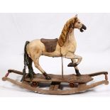 ANTIQUE CHILDS WOOD ROCKING HORSE, H 33:, L 59", D 14"Having a carved wood mane, leather saddle