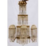 CRYSTAL AND D'ORE BRONZE CHANDELIER, H 40", DIA 26"Having four tiers d'ore bronze rims, six