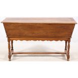 CONTINENTAL OAK DOUGH BOX ON STAND, 19TH C., H 32", W 25", L 59"In two parts: the dough box of