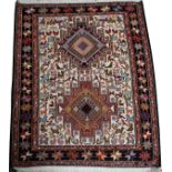 TURKISH HANDWOVEN WOOL RUG, 3' 5" X 2' 9"Decorated with stylized animals and a geometric star