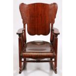 MAHOGANY ROCKING CHAIR, H 39", W 24"A solid wood contoured carved seat back with spindles at the