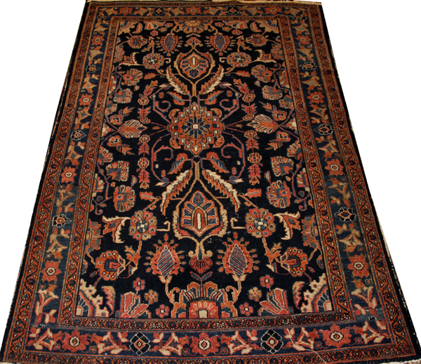 SEMI-ANTIQUE PERSIAN WOOL RUG, C. 1920-1950, W 4' 5", L 6' 8"Navy blue ground with a semi-