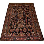 SEMI-ANTIQUE PERSIAN WOOL RUG, C. 1920-1950, W 4' 5", L 6' 8"Navy blue ground with a semi-