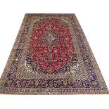 PERSIAN KASHAN WOOL CARPET, 1990-00, 11' 4" X 8' 4"Colors of red, light blue, navy, ivory, and