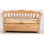 CONTINENTAL BENCH WITH HINGED SEATS, H 34" L 68"Possibly Danish, early 20th century. Having a shaped