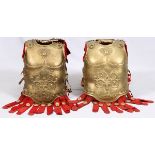 TWO PROP GOLD-PAINTED BREASTPLATES FROM "BEN HUR"Metro-Goldwin-Mayer, 1959. Gold-painted metal front