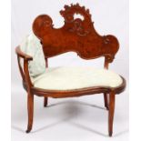 UPHOLSTERED MAHOGANY ONE-ARMED SETTEE, H 35", W 33"Having a carved scrolling leaf crest at the back,