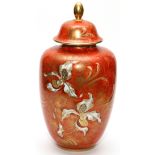 GERMAN PORCELAIN HAND PAINTED COVERED URN, H 13"Floral motif on a dark orange ground. Lid has a