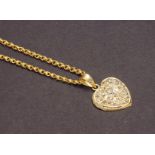 Heart shape gold and diamond pendant