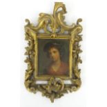 Portrait of a young girl onto wooden panel, mounted in a floral carved gilt wood frame, 30cm x