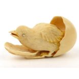 Carved ivory chick breaking out of an egg, 6.5cm wide : For Condition Reports please visit www.