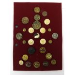 Selection of gilt metal and ivory buttons including animal examples, mounted on a card, the