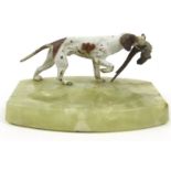 Cold painted bronze model of a setter holding a pheasant mounted on a green alabaster ashtray,