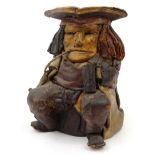 English leather polychrome  toby jug  in the form of a seated man smoking a pipe. , 23cm high :