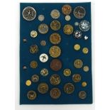 Selection of gilt metal and plastic buttons, mainly birds, mounted on a card, the largest 3.5cm