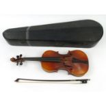 Old wooden cased violin and a cello bow, the back 37cm long :For Condition Reports please visit