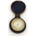 Cased Newton & Co London compensated pocket barometer, 4.7cm diameter :For Condition Reports