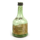 1865 green glass American cognac bottle, State of Maryland liquor tax label to side, 21cm high :