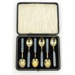 Cased set of six stylish silver gilt and enamel teaspoons marked '925', 10cm long :For Condition