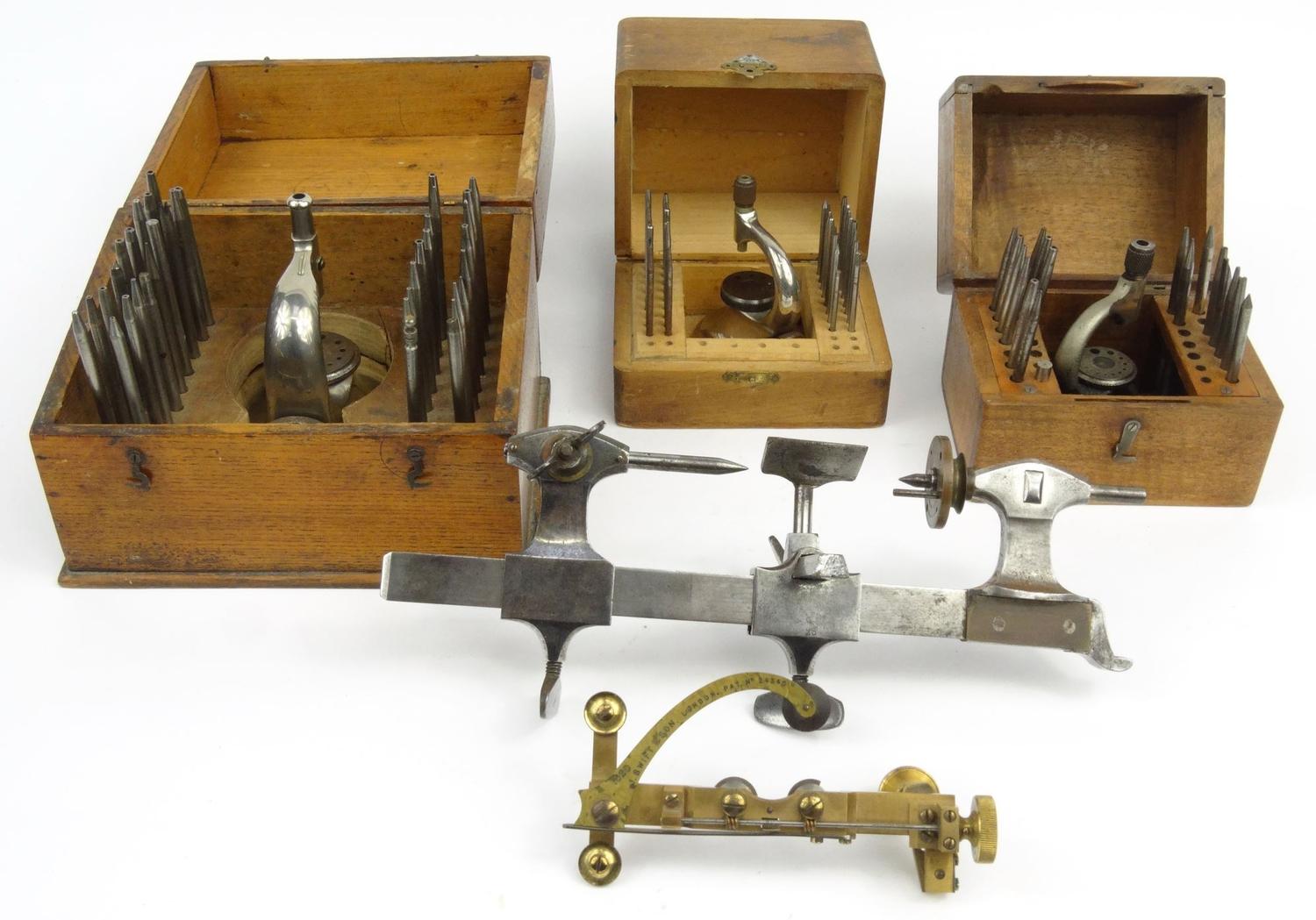 Three wooden cased watchmaker's toolkits J. Swift & Son, London :For Condition Reports please