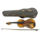 Old cased wooden violin, together with a bow, the back 37cm long :For Condition Reports please visit