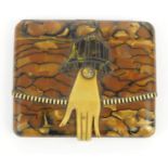 Lady's Art Deco plastic cigarette case modelled as a clutch bag with hand, the clasp marked 'SWN',