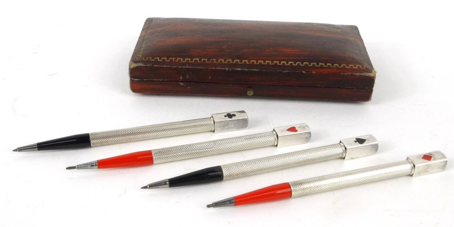 Cased set of four sterling silver and enamel bridge pencils, marked 'Sterling Silver', each pencil