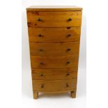 Pine seven drawer bow front chest, 123cm tall : For Condition Reports Please visit www.